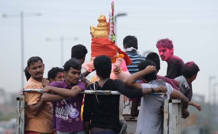 Devotees carry an idol of lord Ganesh during the Ganesh Chaturthi festival in New Delhi.