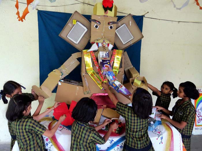 Shcool children make a Ganesha idol with eco-friendly articles in Mulund, Mumbai.