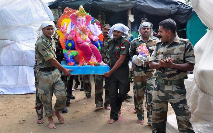 Army soldiers carrying an idol of Lord Ganesh to their battalion in Patiala.