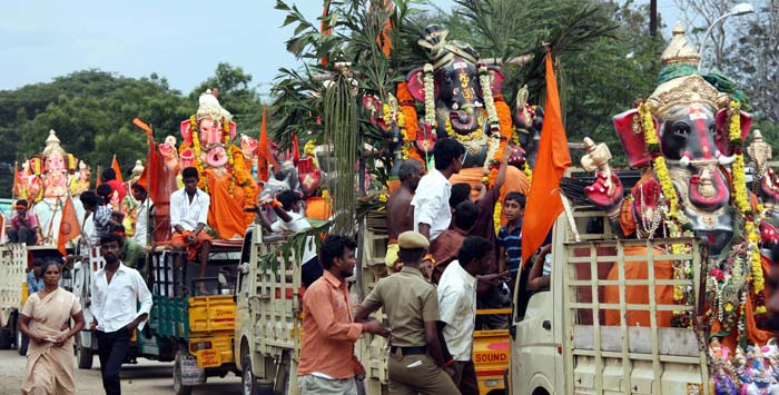 Devotees carrying idols of the Lord Ganesha to immerse near Kurichi pond during the Ganesh utsav in Coimbatore.