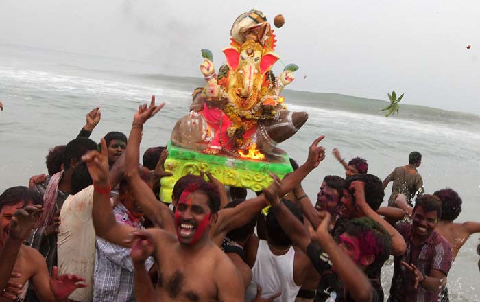 Lord Ganeshas idol being carried to immerse in the sea, after the Vinayaka Chaturthi festival in Chennai.