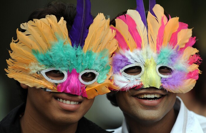 Members of a gay parade pose as they participate in the celebrations in Mumbai.<br><br>For all the celebrations and talk of an historic milestone, many believe it will take more than a court decision to change public attitudes toward homosexuality, which is largely taboo in our country and considered by many to be a mental illness. (AFP Photo)