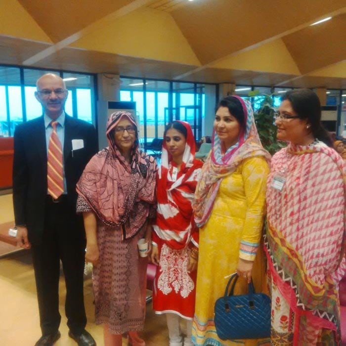 Members of Edhi Foundation with Geeta at the Karachi airport before she leaves for India.