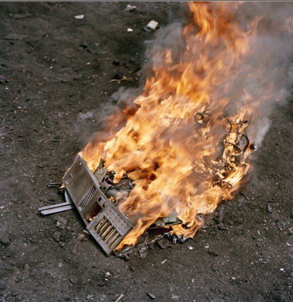 At the dump, the machines are dismantled and often burned to extract metals for resale. The equipment in this digital cemetery come mainly from Europe and the United States, sometimes as secondhand donations meant to reduce the "digital divide'' - the disparity in computer access between poor nations and rich. (Photo credit: Pieter Hugo for The New York Times)