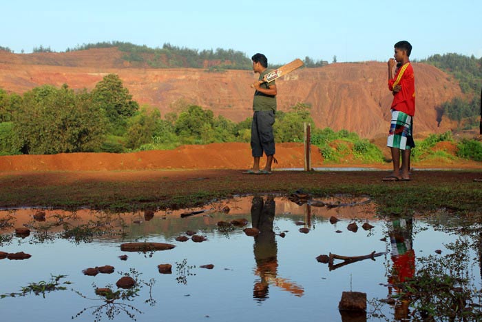 On the edge of Sirigao villlage in Bicholim, we came upon this sight: A cricket match in progress in the crimson glow of an abandoned mining pit.