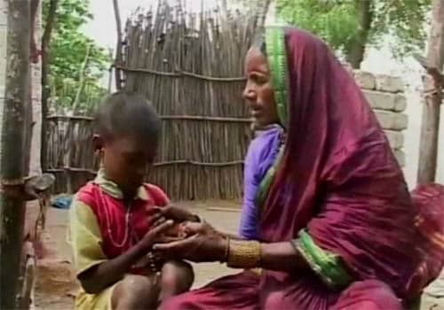 <span class="lh16 fa fs12 fb"><strong>All that she is left with:</strong> Huligamma plays with her grandson.</span>