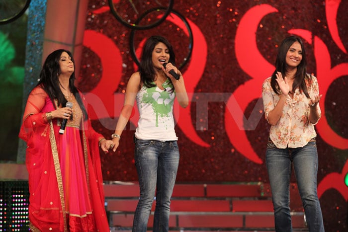 Priyanka sings along while Lara claps.