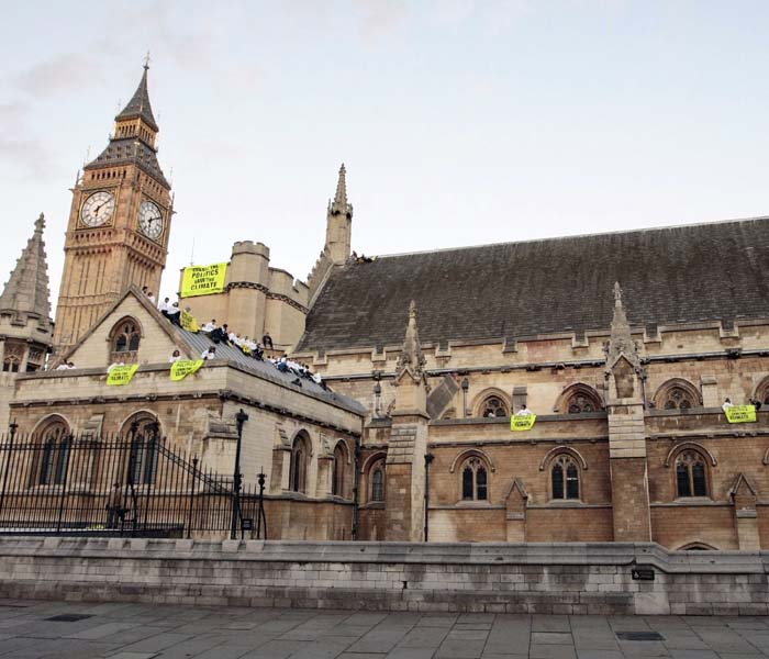 <p>Greenpeace volunteers' protests on climate change have virtually hit the roof with activists scaling the walls of the British Houses of Parliament and occupying the roof of the historic building. </p>
<p>Brikesh Singh, an Indian professor and a campaigner from Greenpeace India, is among those staging a sit-in.&nbsp;(AFP Photo)</p>