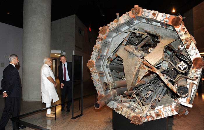 PM Modi looks at an exhibit at Ground Zero, the 9/11 memorial in New York, USA. (Press Trust of India photo)