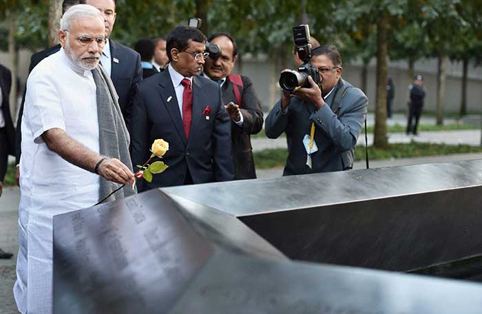 Prime Minister Narendra Modi paying tribute at Ground Zero, the 9/11 memorial, in New York, USA on Saturday. (Press Trust of India photo)