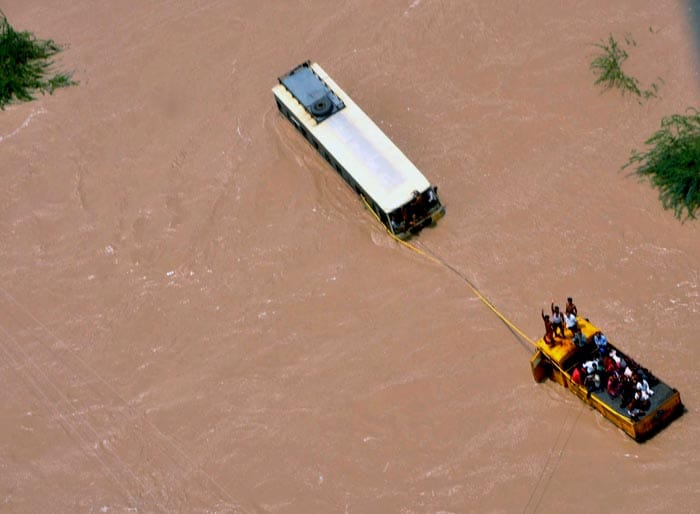 Some people had taken shelter on top of buses at Panchasar village in Patan district. The Air Force pressed choppers into service from bordering Rajasthan to rescue these people.