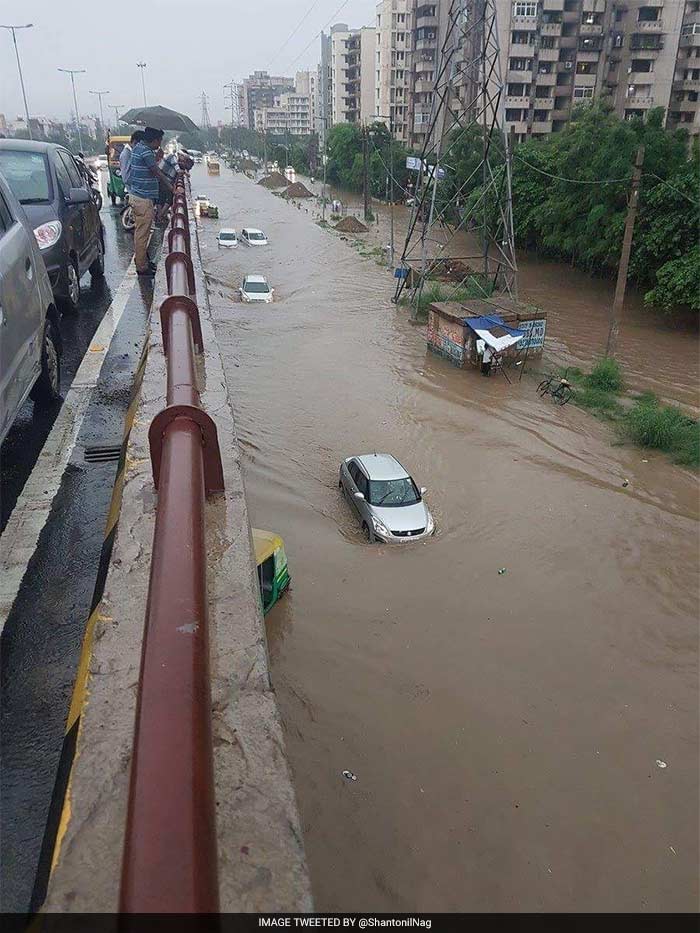 Pics: Rain Cripples Gurgaon As Traffic Comes To Stand-Still