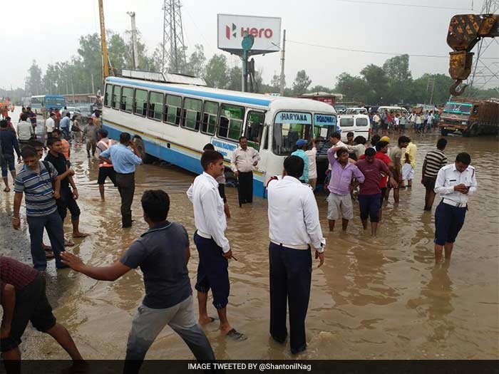 Pics: Rain Cripples Gurgaon As Traffic Comes To Stand-Still