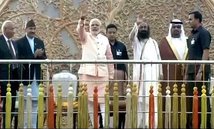 Prime Minister Narendra Modi's arrival at the venue waving to the crowd next to the organiser Sri Sri Ravi Shankar marked the beginning of the event.