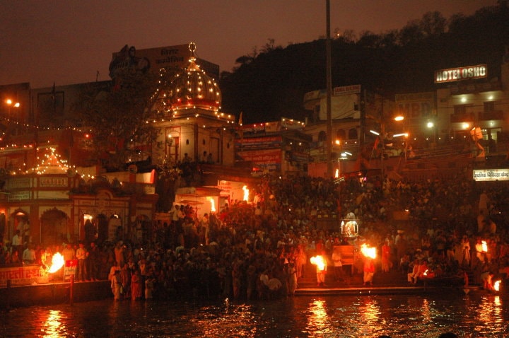 In just about half an hour, the aarti, a daily ritual is over, and the crowd starts to disperse. What's left behind are thousands of beautiful diyas floating along the river and devotees taking a holy dip in the, now, dark waters of the Ganga. (Image Courtesy: Tejas Mehta)