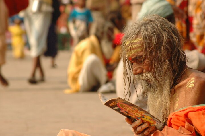 Lost in his chants, amidst the hustle bustle of the temple town, a sadhu sits by the river bank after a dip in the holy Ganga.(Image Courtesy: Tejas Mehta)