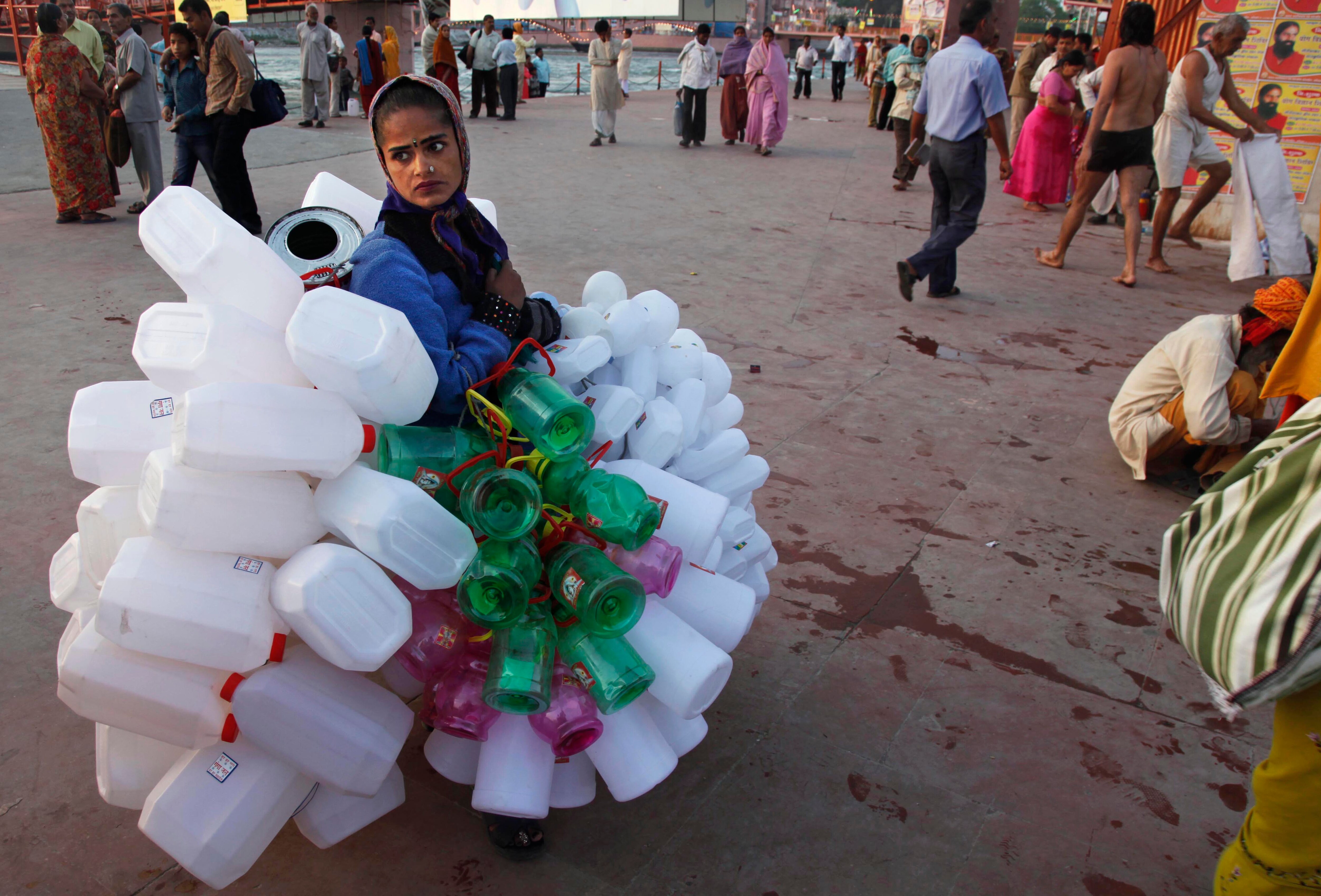 A vendor sells plastic cans meant for filling water from the Ganga, during the Kumbh Mela in Haridwar. (AP photo)