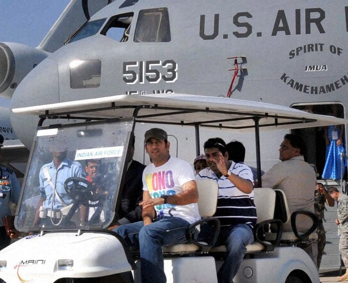 Indian cricket captain MS Dhoni on a different turf altogether. The captain who is known for his penchant for speed and love for bikes came visiting Bangalore, to witness first hand the supersonic jets, soaking it all in. (Phot courtesy: PTI)