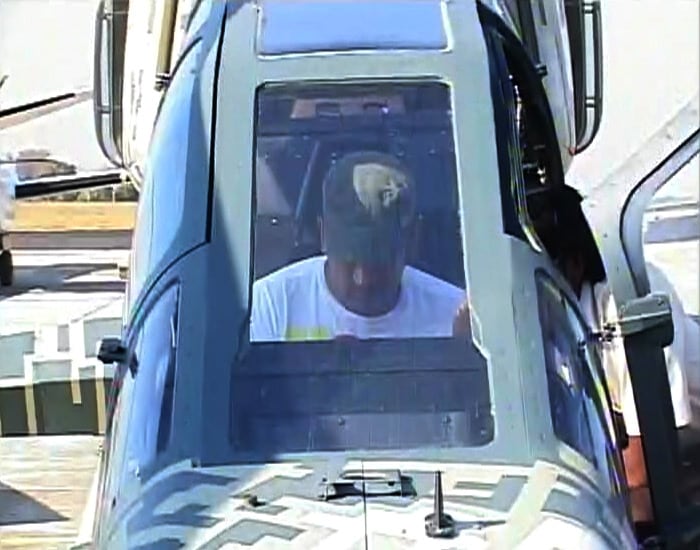 Dhoni on a different altitude altogether. He sits inside the cockpit of a fighter aircraft as he visits the Aero India 2011 show in Bangalore.(Photo courtesy: AP)