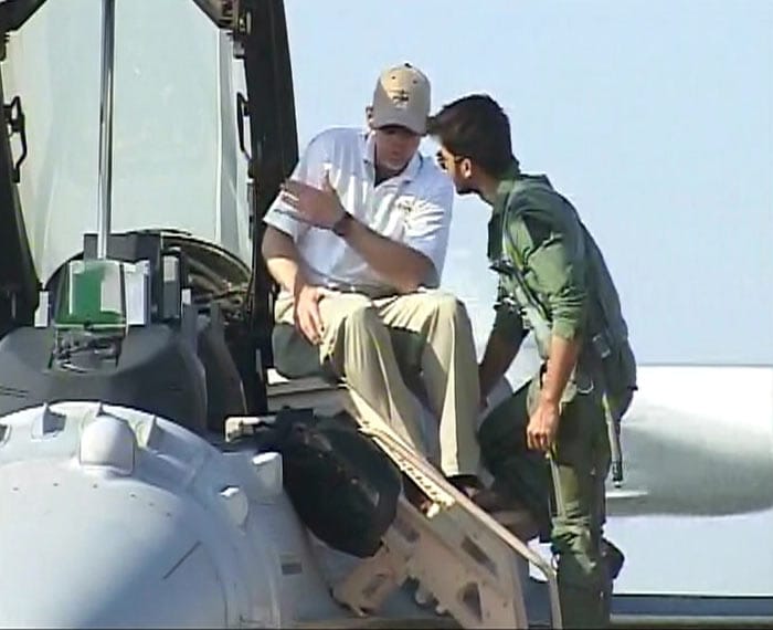 Shahid about to step into the Lockheed Martin F-16 Super Viper. Is seen listening keenly to his instructor. (Photo courtesy: PTI)