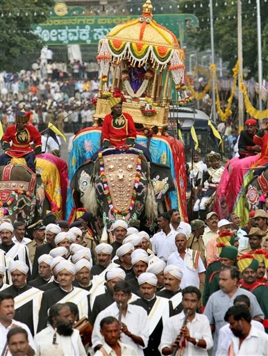 An idol of Hindu goddess Chamundeeswari, placed in a gold howdah, is carried on an elephant through the streets on the last day of Dussera celebrations in Mysore, 145 kilometers (91 miles) south west of Bangalore, India, Monday, October 2, 2006. According to Hindu mythology the festival celebrates the slaying of the demon Mahishasura by the Goddess Chamundeeswari or Durga and the triumph of good over evil.