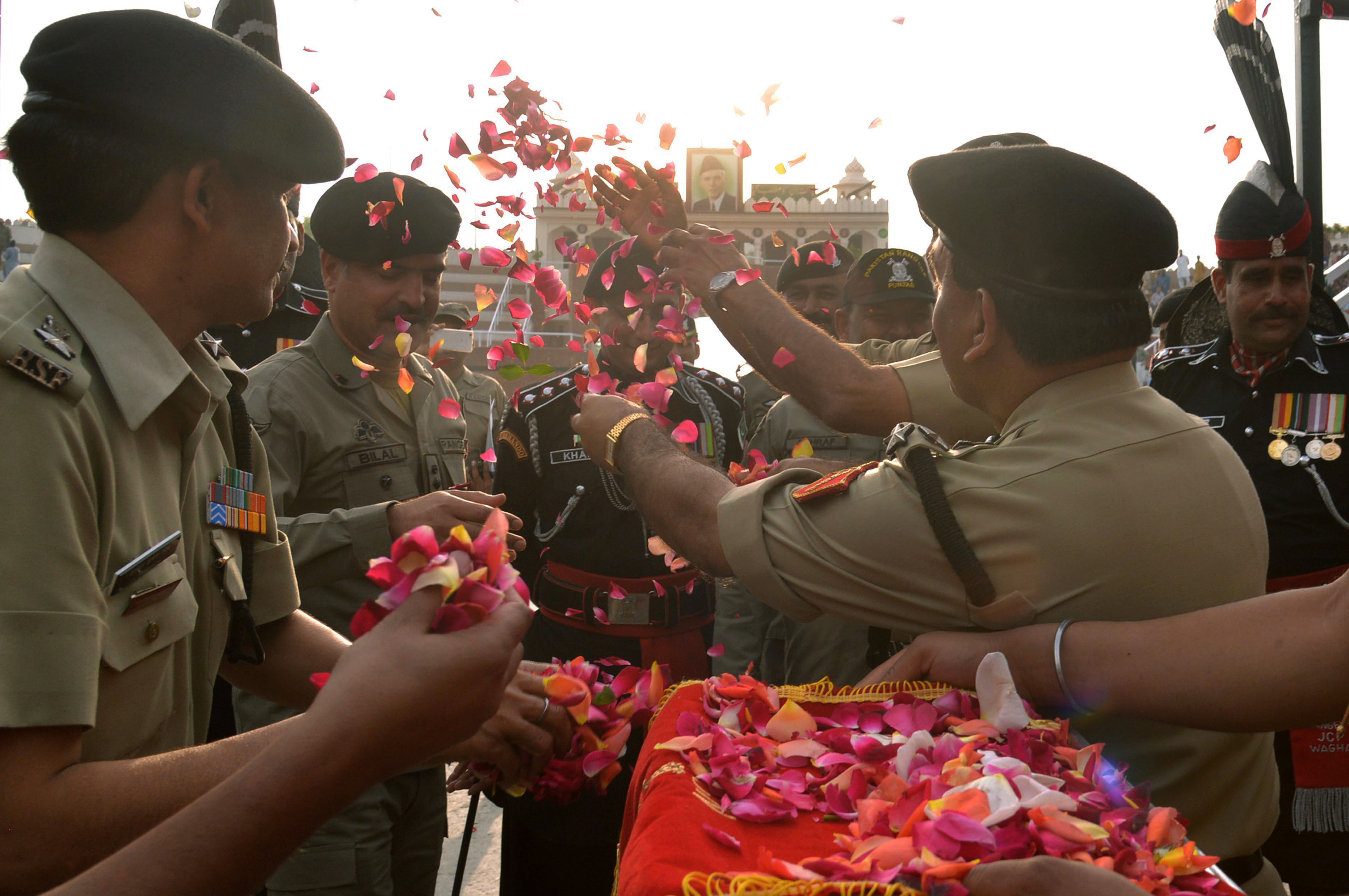 The Border Security Force personnel and Pakistan Rangers celebrated the festival with flowers at Zero line (Joint Check Post) of Attari. (PTI photo)