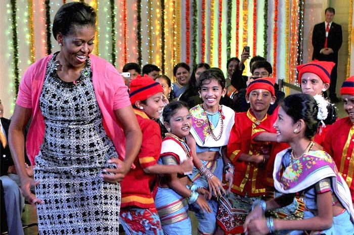 A dancing Michelle Obama became the defining image of the Obamas' maiden visit to India. The US First Lady hit the dance floor not just once, but twice.<br><br> The whole country watched Michelle Obama shaking a leg to hit Bollywood number <i>Rang De Basanti</i> during her interaction with school kids in Mumbai.