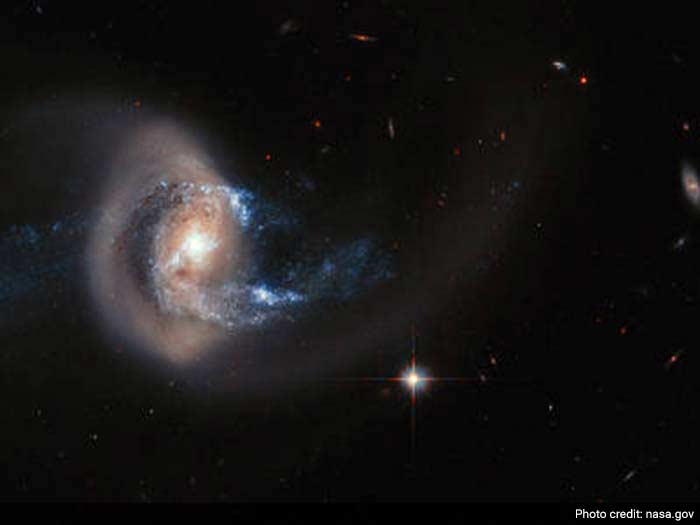 NASA: NGC 7714 presents an striking view of the galaxy's smoke-ring-like structure.