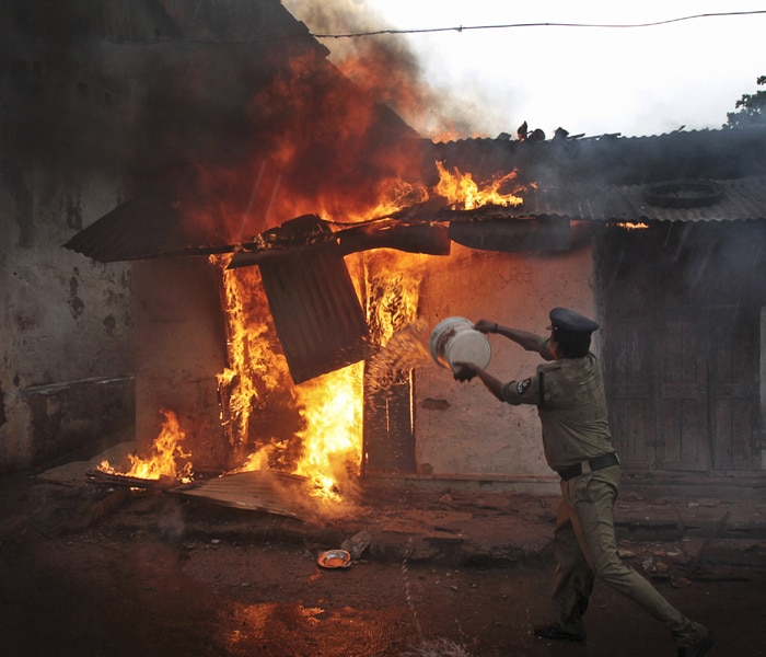 "We have intensified patrolling in lanes and by-lanes in curfew-affected areas where communal clashes took place during the last three days," Hyderabad City Police Commissioner A K Khan said. He said though the situation was tense, it was totally under control with the deployment of a large number of security forces including RAF and CRPF.(AP photo)