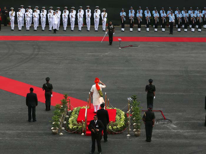 Prime Minister Narendra Modi inspects a guard of honour for the country's 68th Independence Day at the Red Fort in New Delhi on August 15, 2014.