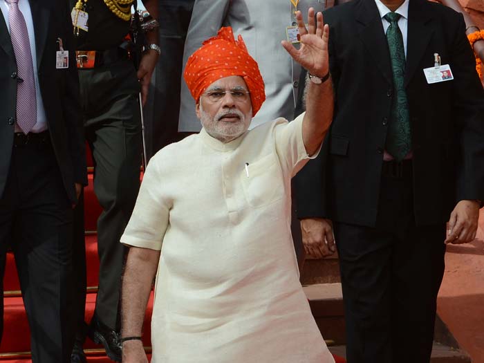 Prime Minister Narendra Modi waves after delivering a speech from the ramparts of the Red Fort in New Delhi on August 15, 2014, to mark the country's 68th Independence Day.