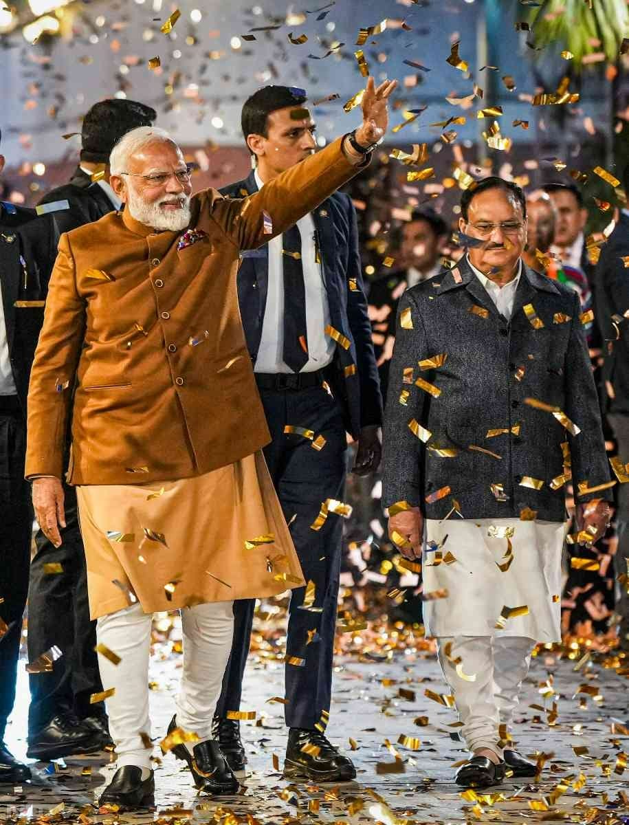 PM Modi greets BJP supporters as he arrived at the party headquarters in Delhi after big win.