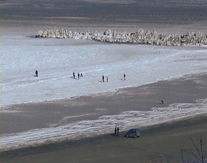 At the Black Sea beach resort of Constanta, the waters washing onto the beach were frosted over, so that people were able to walk on the frozen shallows.