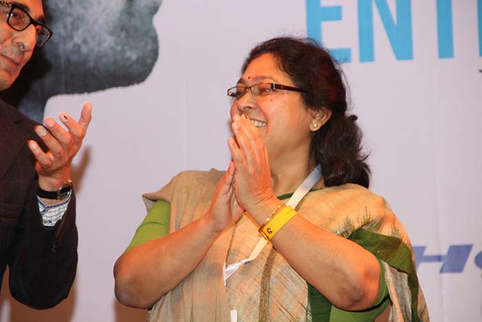 The President of IIIMC Alumni Association Sunila Dhar on the IIMC stage.