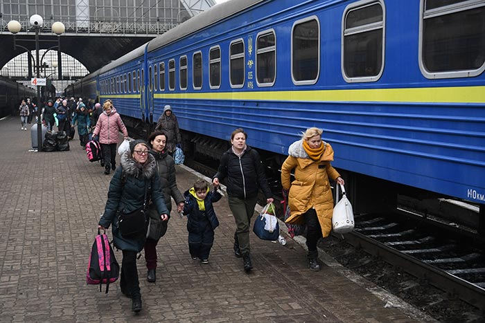 In Pics: Fleeing Russians, Trains Packed With Ukrainians Pour Into Lviv