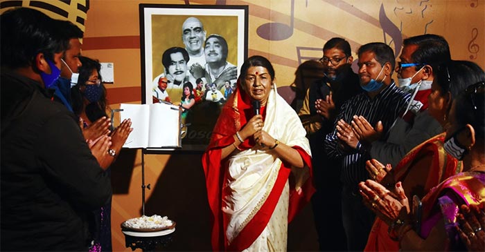 People pay homage to the wax statue of legendary singer Lata Mangeshkar, who died at the age of 92, at Mother's Wax Museum, in Kolkata on Sunday. (ANI Photo)