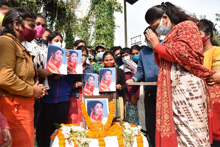 Agartala: People pay floral tribute to veteran singer Lata Mangeshkar, in Agartala, Sunday, February 06, 2022. Lata Mangeshkar died at Breach Candy hospital in Mumbai. (PTI Photo)