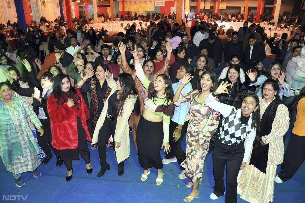 People celebrate on the eve of the new year 2025, in Kanpur, Uttar Pradesh