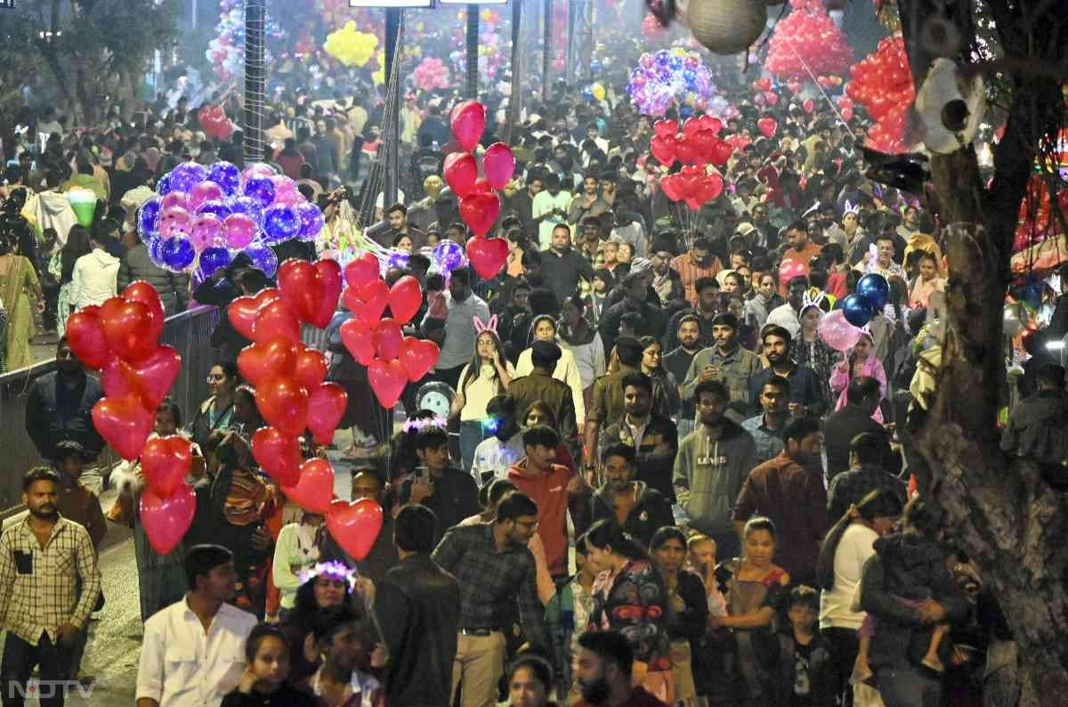 People gather during celebrations on the eve of the new year in Ahmedabad