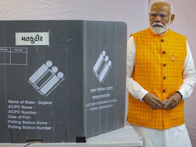 Photo : In Pics: PM Modi Votes In Ahmedabad, Waves At Crowd, Meets Supporters