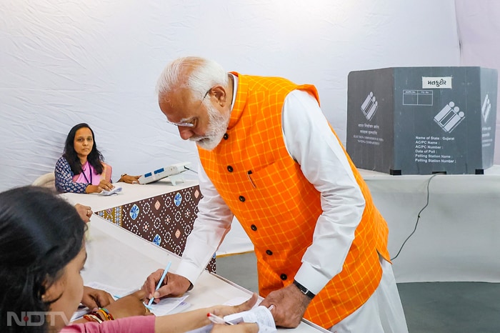 In Pics: PM Modi Votes In Ahmedabad, Waves At Crowd, Meets Supporters