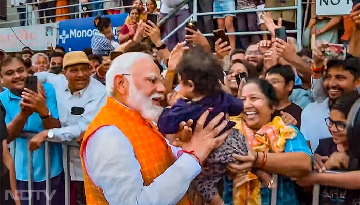 In Pics: PM Modi Votes In Ahmedabad, Waves At Crowd, Meets Supporters