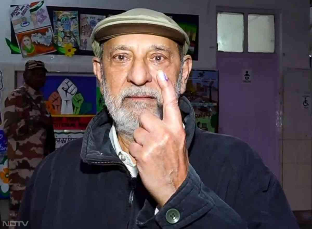 Berger Paints Chairman Kuldip Singh Dhingra shows his inked finger after casting his vote at a polling booth in New Delhi