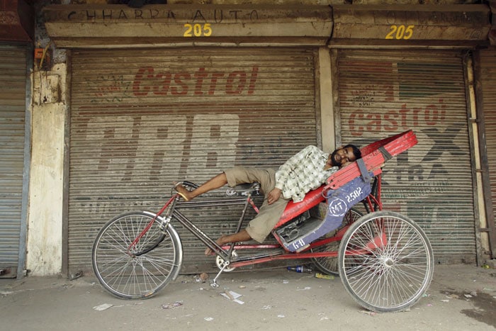 The people working in the scorching heat complain of nausea and dehydration due to excessive sweating. (AP Photo)