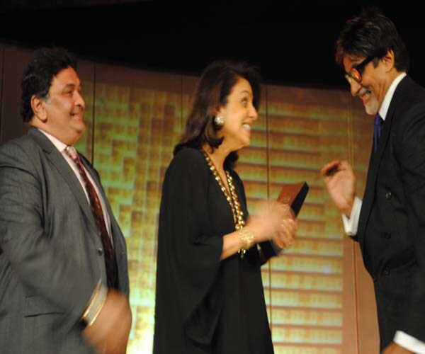 Ranbir has successfully earned the tag of being one of Bollywood's most bankable young stars with two consecutive hits this year- Wake Up Sid and Ajab Prem Ki Ghazab Kahani. He was the Male Entertainer of the Year. Seen here, Ranbir's mother, Neetu Singh receiving the award on his behalf from Amitabh Bachchan as Rishi Kapoor looks on.<br><br>
<a target="_blank" class="text2bold_link" href="http://www.ndtv.com/convergence/ndtv/new/ioy09/ioyhome09.aspx">NDTV Indian of the Year: And the winners are...</a>