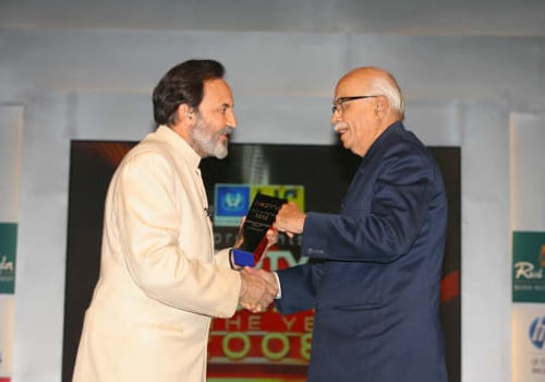 Chairman, New Delhi Television Limited, Dr Prannoy Roy hands over NDTV's Special Award for Lifetime Achievement to L K Advani, BJP's Prime Ministerial candidate for 2009, at the Indian of the Year awards ceremony, on January 21, 2009.
