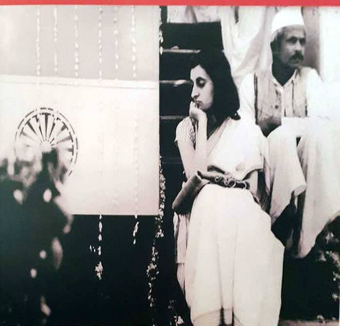 Indira Gandhi travelling in a train with a  casket carrying Mahatma Gandhi's remains.