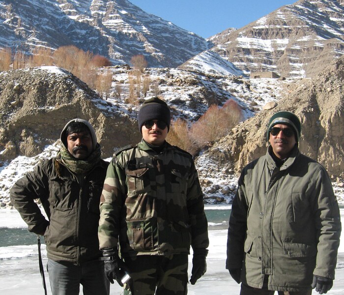 Sajjilal, NDTV's cameraperson and Nitin Gokhale with an army doctor. Frozen Indus can be seen in the background.(NDTV photo)