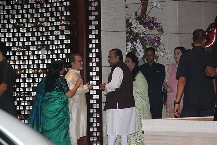 Mukesh Ambani, father of the to-be-bride, welcomes guests to Isha Ambani's engagement party