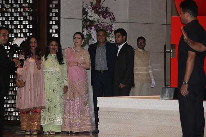 Neeta Ambani poses for a picture with brother-in-law Anil Ambani and his wife Tina Ambani